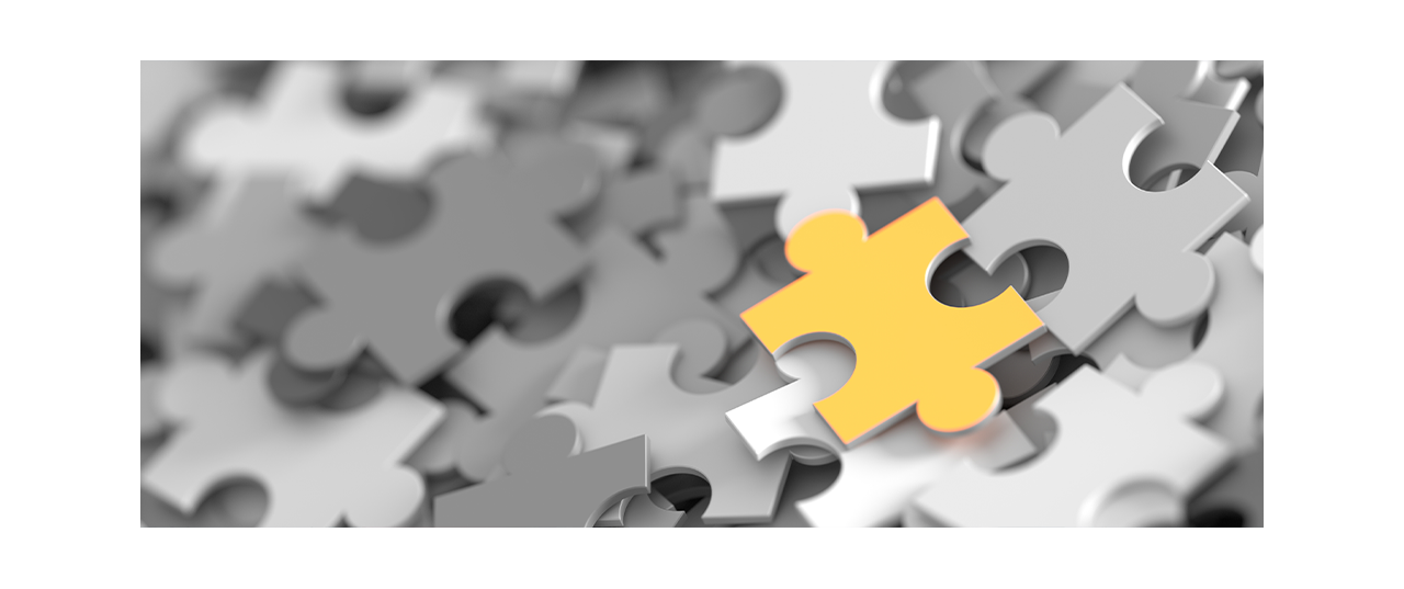 Gray puzzle pieces with single yellow puzzle piece