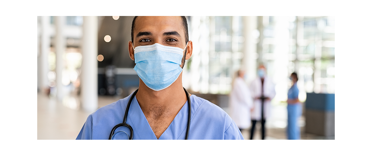 Medical worker looking face on toward with surgical mask