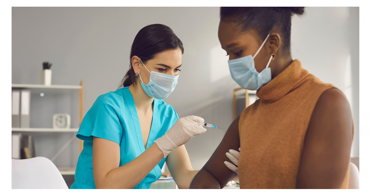 woman giving patient a shot