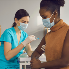 woman giving patient a shot